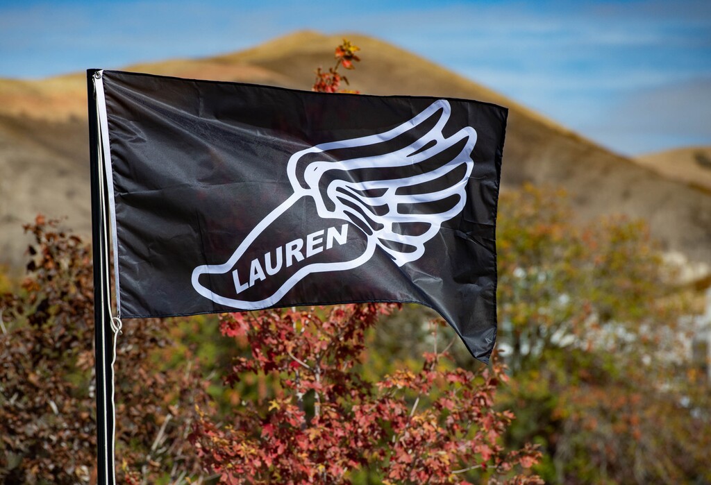 (Francisco Kjolseth  |  The Salt Lake Tribune) People gather for a memorial walk on the track where University of Utah student and track athlete Lauren McCluskey used to compete on the two-year anniversary of her murder on Thursday, Oct. 22, 2020.