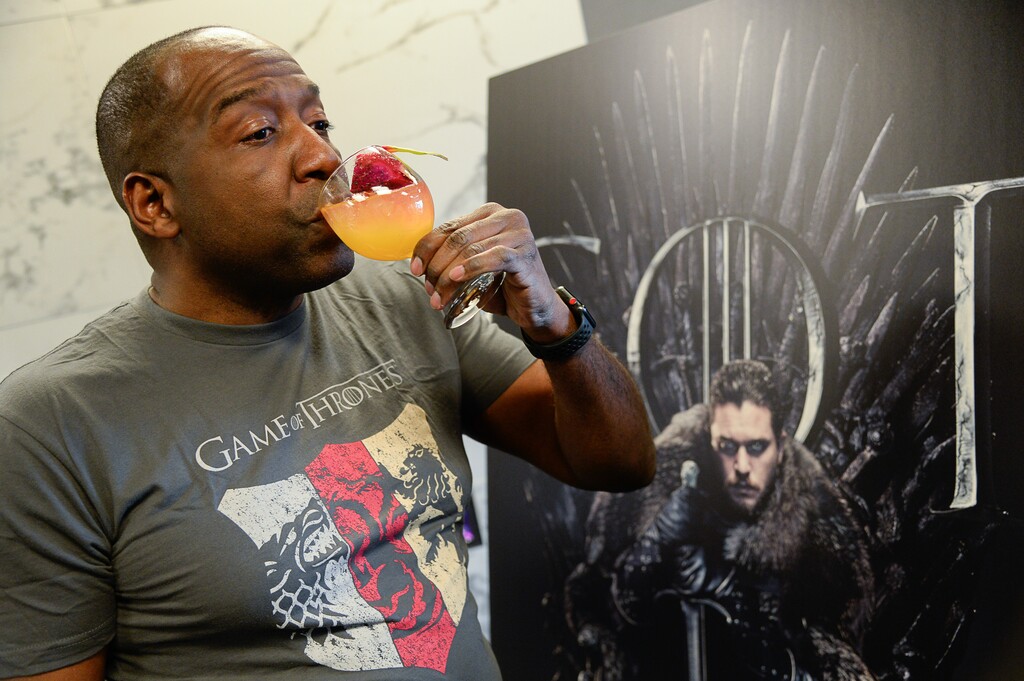 (Francisco Kjolseth  |  The Salt Lake Tribune)  Oz Hutton, owner of Melange Liquid Catering, a Salt Lake City bartending service, tries his Mother of Dragons mocktail for a private "Game of Thrones" screening in Holladay, exclaiming "it's delicious." The drink is made with nonalcoholic triple sec, mango nectar, ginger ale, lime, cayenne pepper and garnished with dragon fruit.