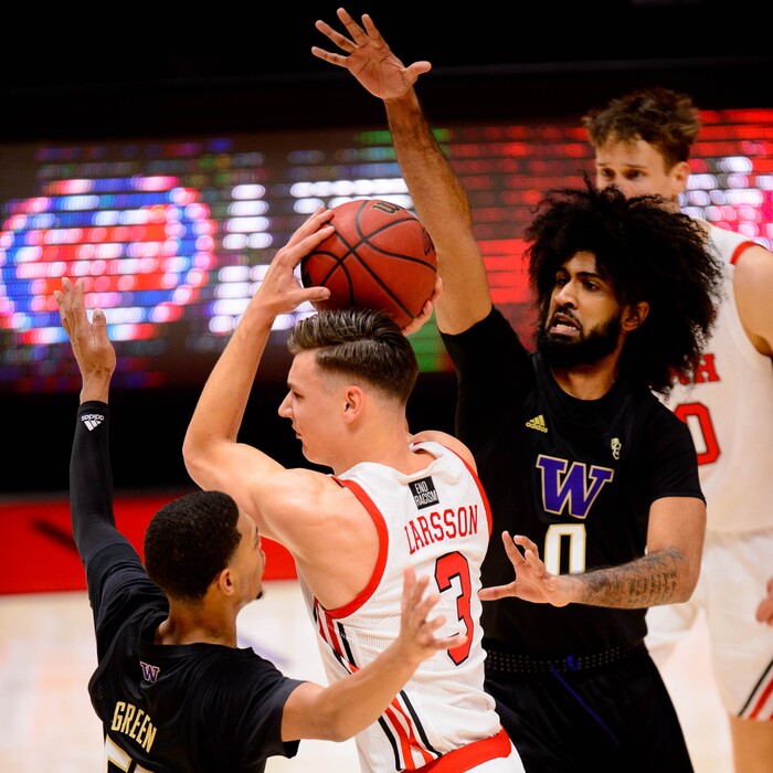 (Trent Nelson | The Salt Lake Tribune) Utah's Pelle Larsson drives between Washington's Quade Green and Marcus Tsohonis as Utah hosts Washington, NCAA basketball in Salt Lake City on Thursday, Dec. 3, 2020.