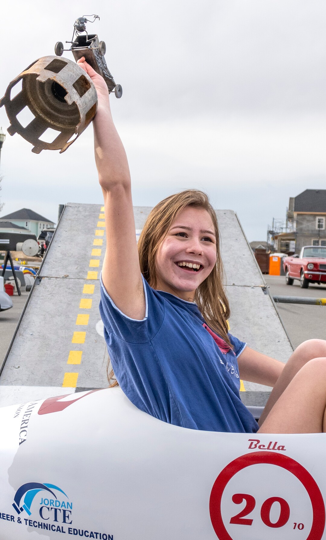 (Rick Egan | The Salt Lake Tribune) Bella Jeffries holds up the first place trophy in the Stock Division, at the Daybreak Soap Box Derby, on Saturday, April 24, 2021.
