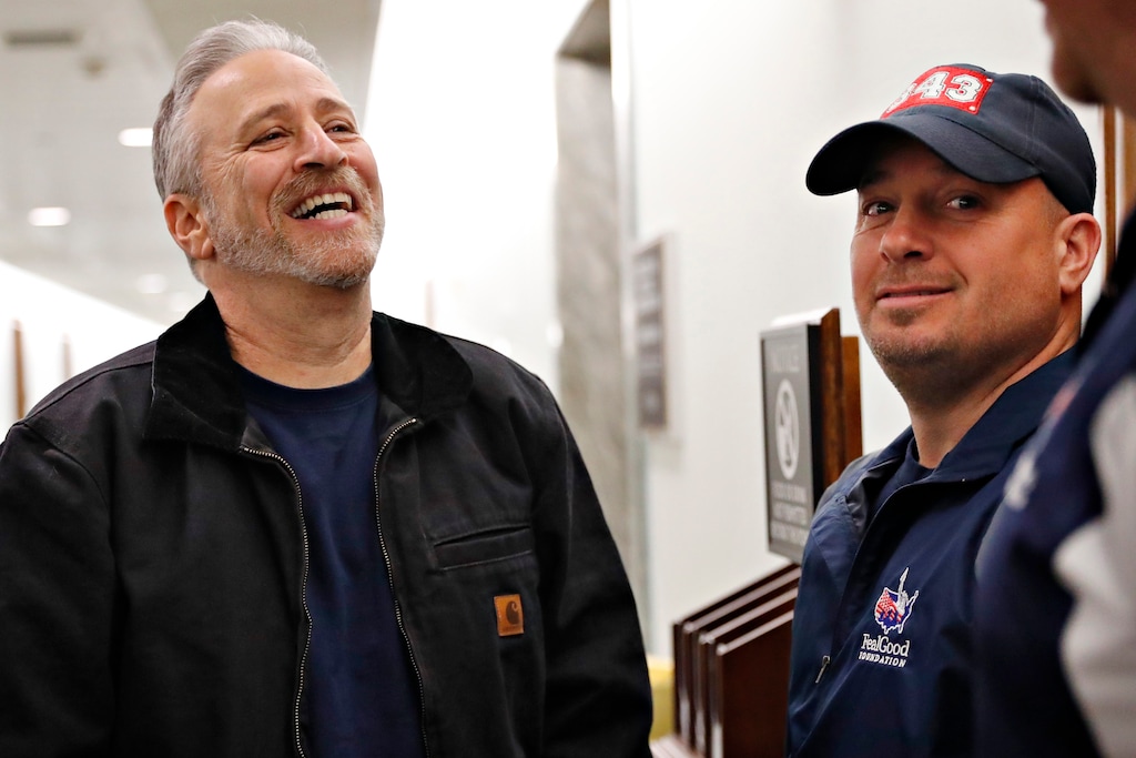 (Jacquelyn Martin | AP file photo) Entertainer and activist Jon Stewart, left, speaks with members of the FealGood Foundation as they arrive on Capitol Hill to speak with lawmakers about the compensation fund for victims of 9/11, Monday, Feb. 25, 2019, on Capitol Hill in Washington. Stewart has been involved in urging support for the first responders, volunteers, and survivors of the September 11 attacks.