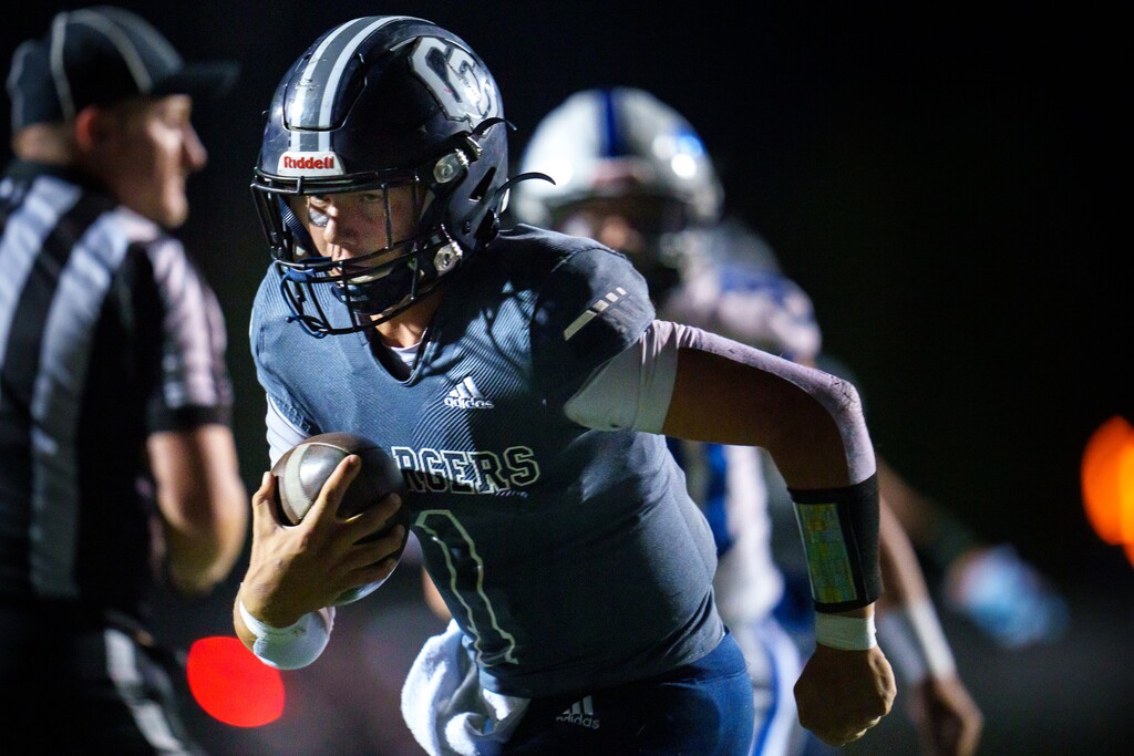 (Trent Nelson  |  The Salt Lake Tribune) Corner Canyon quarterback Isaac Wilson runs for a touchdown vs Pleasant Grove, in Draper on Wednesday, Oct. 12, 2022.