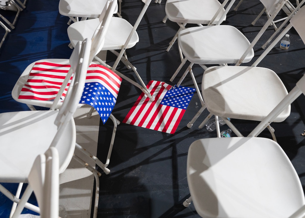  Chairs and flags are scattered after President Donald Trump’s 100th day in office rally in Warren, Mich., April 29, 2025. The question at the heart of the midterms: is anyone normal? (Daniel Ribar/The New York Times)