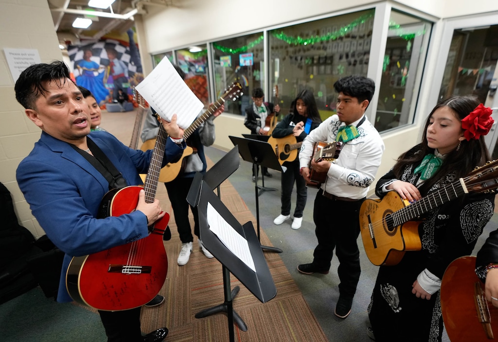 (Francisco Kjolseth | The Salt Lake Tribune) Allan Moreno works with kids from Esperanza Elementary in West Valley City on Wednesday, March 22, 2023, where he has assembled the first kids' mariachi band in Utah.