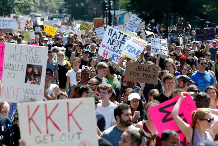 Counterprotesters stand on the periphery of a "Free Speech" rally staged by conservative activists on Boston Common, Saturday, Aug. 19, 2017, in Boston. One of the planned speakers of a conservative activist rally that appeared to end shortly after it began says the event "fell apart." Dozens of rallygoers gathered Saturday on Boston Common, but then left less than an hour after the event was getting underway. Thousands of counterprotesters had also gathered. (AP Photo/Michael Dwyer)