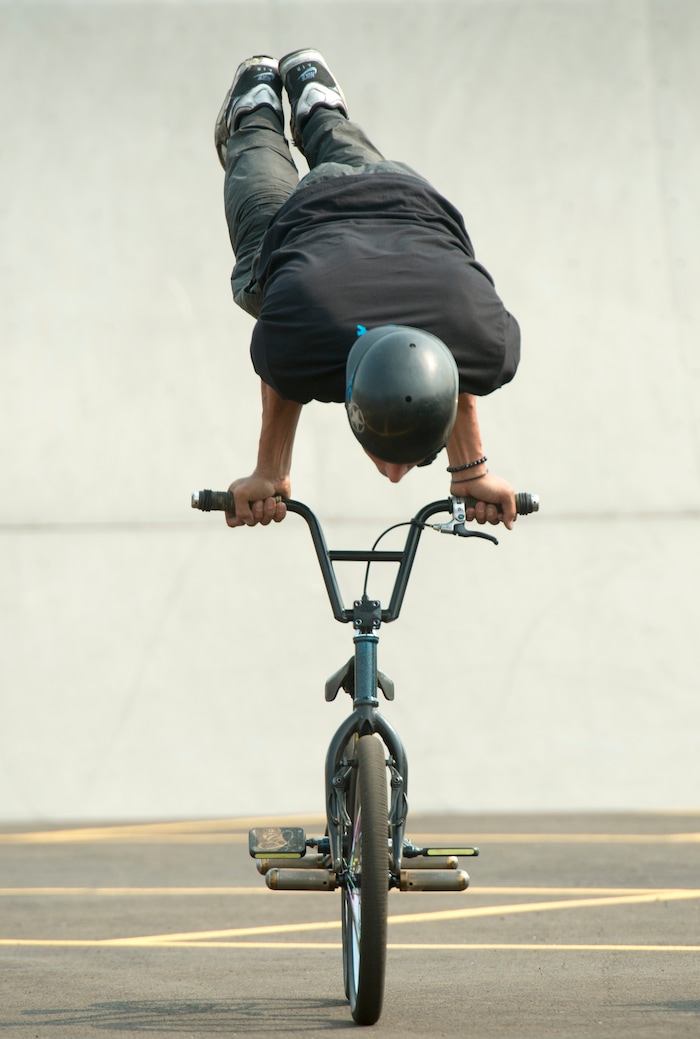 (Rick Egan  |  The Salt Lake Tribune)    Pete Brandt performs a bike trick, during the BMX Stunt Show, at the Davis County Fair in Farmington, Saturday, Aug. 18, 2018.