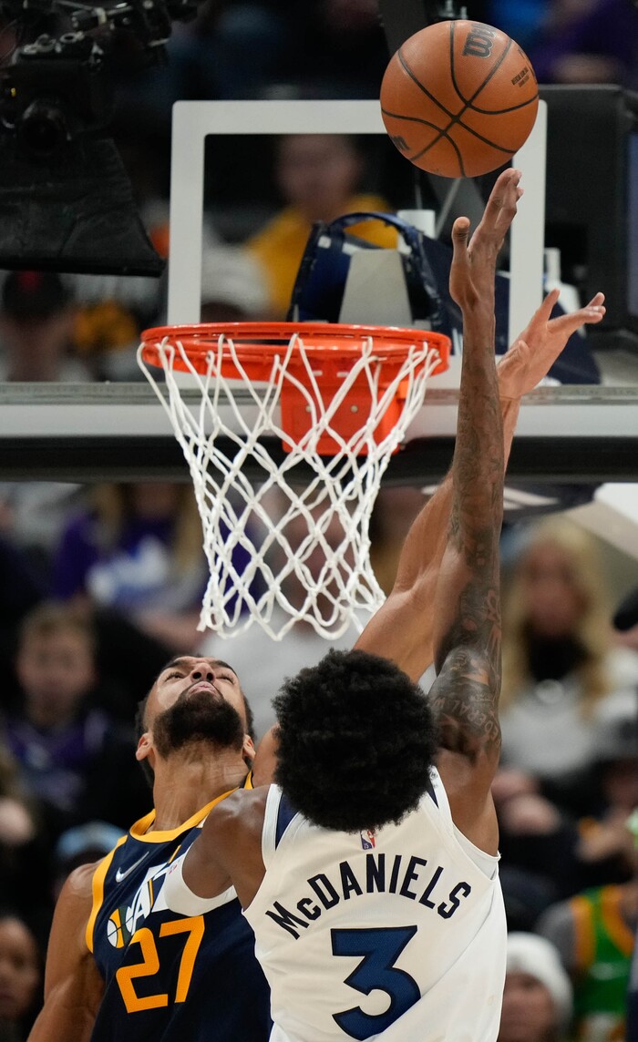 (Francisco Kjolseth | The Salt Lake Tribune) Utah Jazz center Rudy Gobert (27) pressures Minnesota Timberwolves forward Jaden McDaniels (3) in NBA action between the Utah Jazz and the Minnesota Timberwolves at Vivint Smart Home Arena in Salt Lake City, Thursday, Dec. 23, 2021.