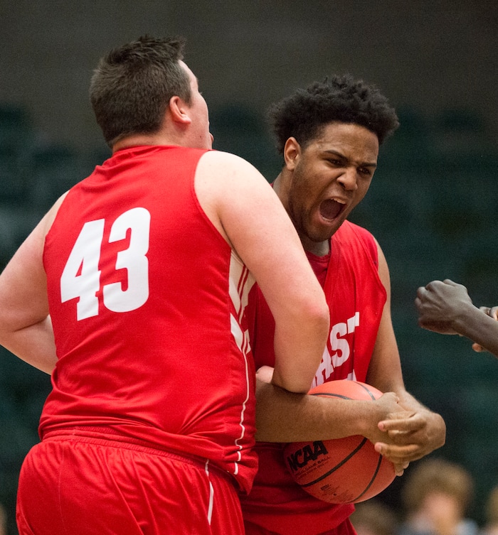 (Rick Egan  |  The Salt Lake Tribune)   East Leopards East Leopards Stockton Christensen (43) and Mikey Frazier (45) celebrate East High's 54-53 win over the Jordan Beatdiggers, in 5A basketball playoff action at the UCCU Center in Orem, Monday, Feb. 26, 2018.