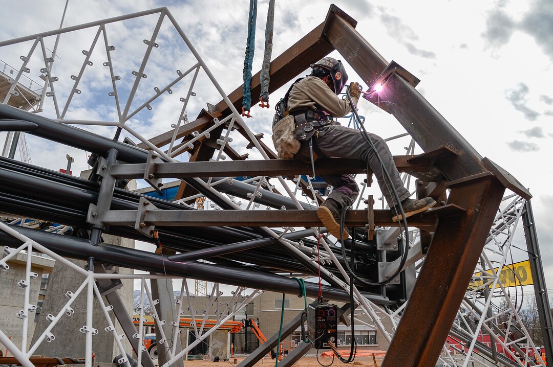 (Francisco Kjolseth  |  The Salt Lake Tribune) Crews prepare the Olympic cauldron as it is returned to the University of Utah on Friday, Jan. 29, 2021, after a refurbishment to lengthen its life span. Removed in February 2020, the cauldron was transported to an off-site location, where all 738 glass panes were removed and the complete structure was sandblasted and refinished. The refurbished structure was placed on a newly constructed, 17-foot-tall pedestal, just north of the stadium ticket office, with plans to add high-quality glass.