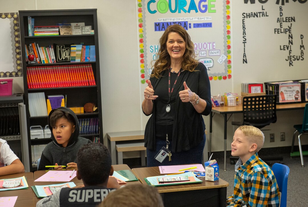 (Rick Egan  |  The Salt Lake Tribune)         Jeri Rigby, the new principal of Copperview Elementary School, sings along with students, on the first day of school, Monday, Aug. 19, 2019.
