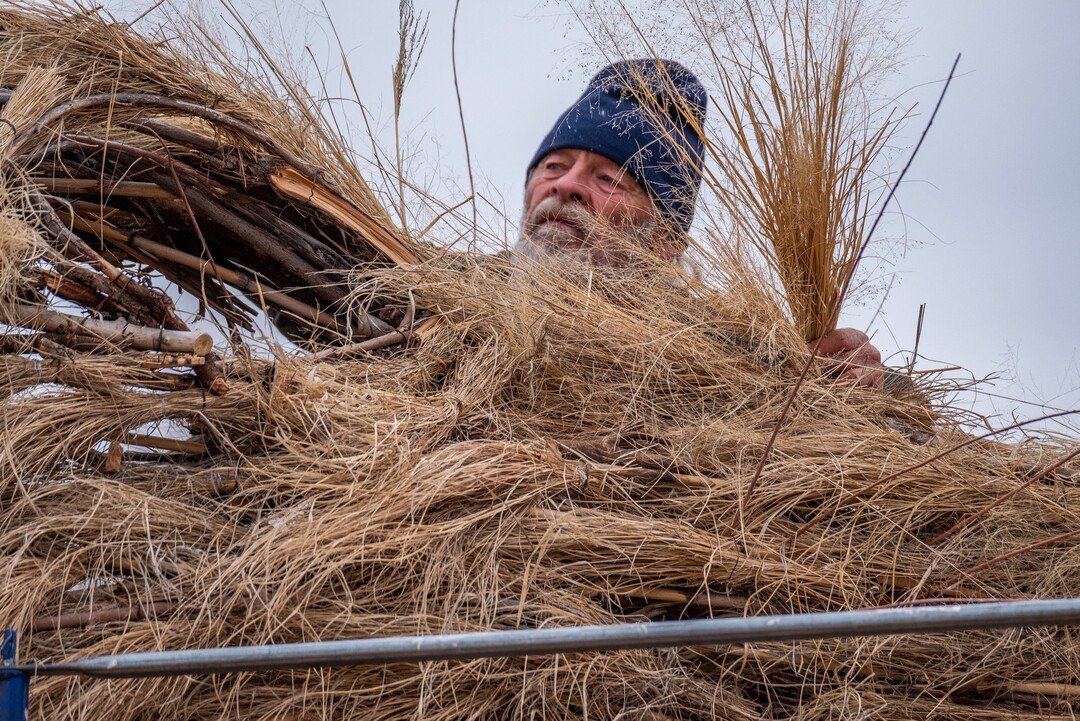 (Photo courtesy of John Gregor | Cold Snap Photography) Artist Joe Pachak at work on his winter solstice sculpture in 2018.