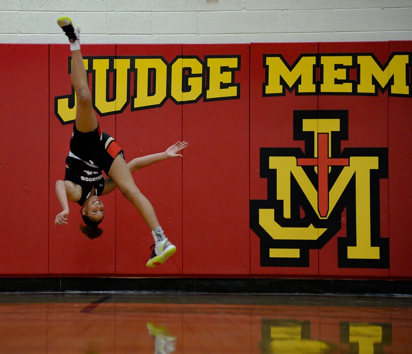 (Francisco Kjolseth | The Salt Lake Tribune) Basketball player Teya Sidberry shows off her athletic skills by doing an aerial flip during a recent practice. Siberry who is just a sophomore on Judge Memorial's girls basketball team is leading the state in scoring and has also done a lot of competitive modern dance, ballet and was also a cheerleader last year.