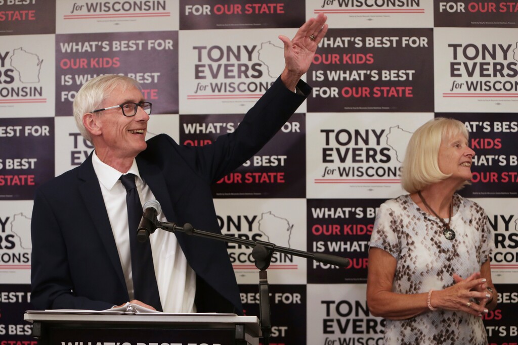 Tony Evers, with his wife, Kathy, speaks after his win in Wisconsin's Democratic gubernatorial primary election during an event at Best Western Premier Park Hotel in Madison, Wis., Tuesday, Aug. 14, 2018. (Amber Arnold/Wisconsin State Journal via AP)