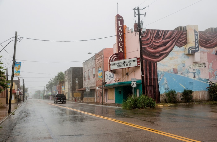 (Ana Ramirez | The Victoria Advocate via AP) A single truck drives down a street as Hurricane Harvey makes landfall in downtown Port Lavaca, Texas on Friday, Aug. 25, 2017. Hurricane Harvey smashed into Texas late Friday, lashing a wide swath of the Gulf Coast with strong winds and torrential rain from the fiercest hurricane to hit the U.S. in more than a decade.
