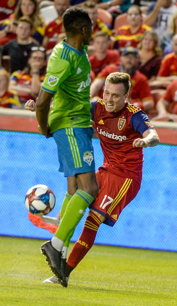 (Leah Hogsten  |  The Salt Lake Tribune) Real Salt Lake forward Corey Baird (17) nails Seattle Sounders defender Kelvin Leerdam (18) in the back with the ball as Real Salt Lake hosts the Seattle Sounders, Aug. 14, 2019, at Rio Tinto Stadium in Sandy.