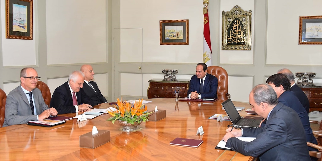 In this Saturday, Aug. 29, 2015 photo provided by Egypt's state news agency MEAN, Eni CEO Claudio Descalzi, third left, and his delegation meet with Egyptian President Abdel-Fattah el-Sissi, center, and an Egyptian delegation, in Cairo, Egypt. The Italian energy company Eni SpA announced Sunday, Aug. 30, 2015, it has discovered a "supergiant" natural gas field off Egypt, describing it as the "largest-ever" found in the Mediterranean Sea. Eni said the discovery made in its Zohr prospect "in the deep waters of Egypt" could hold a potential 30 trillion cubic feet of gas over an area of 100 square kilometers (38.6 square miles). (MEAN via AP)