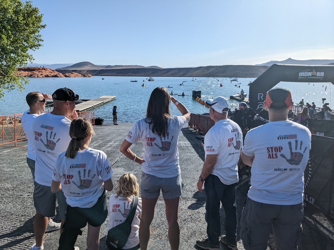 Julie Jag/The Salt Lake Tribune
Kyle Brown's family and friends, including his wife Colleen, center, and brother Trent,  left, await the Kaysville triathlete's return to shore during the 2021 Ironman World Championships at Sand Hollow Reservoir near St. George on Saturday, May 7, 2022. Brown has Lou Gehrig's Disease and was hoping to become just the second person to complete an Ironman championship. His body didn't adjust well to the 65-degree water and he didn't finish before the 2 hour, 20 minute cutoff, but he didn't quit either. He finished the swim in 3:45:24.