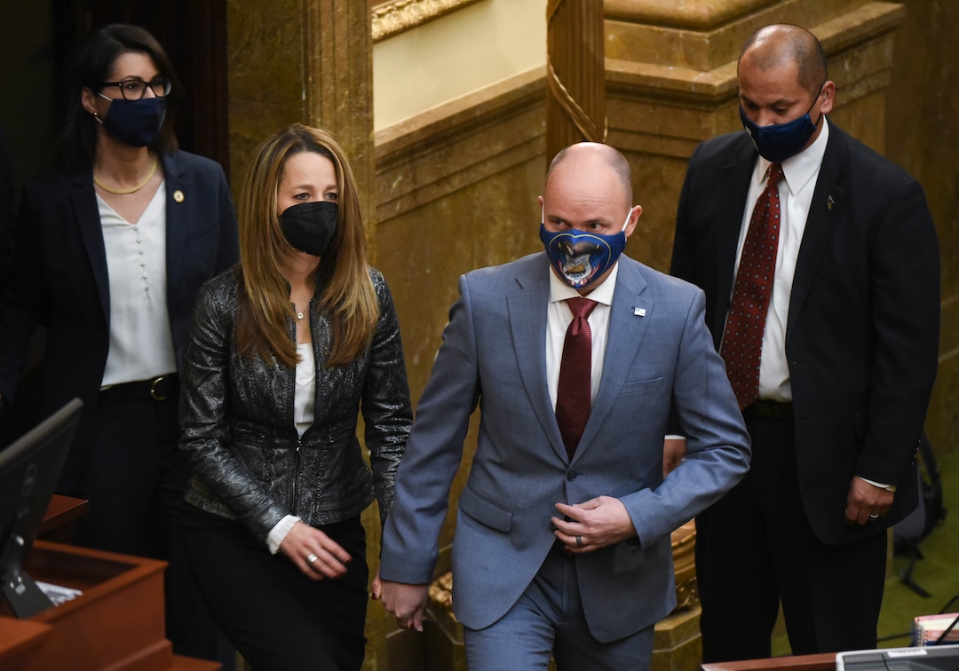 (Francisco Kjolseth  | The Salt Lake Tribune) Gov. Spencer Cox, his wife Abby Cox and Lt. Gov. Deidre Henderson are greeted as they enter the House chamber for the State of the State address at the Capitol in Salt Lake City on Thursday, Jan. 21, 2021.