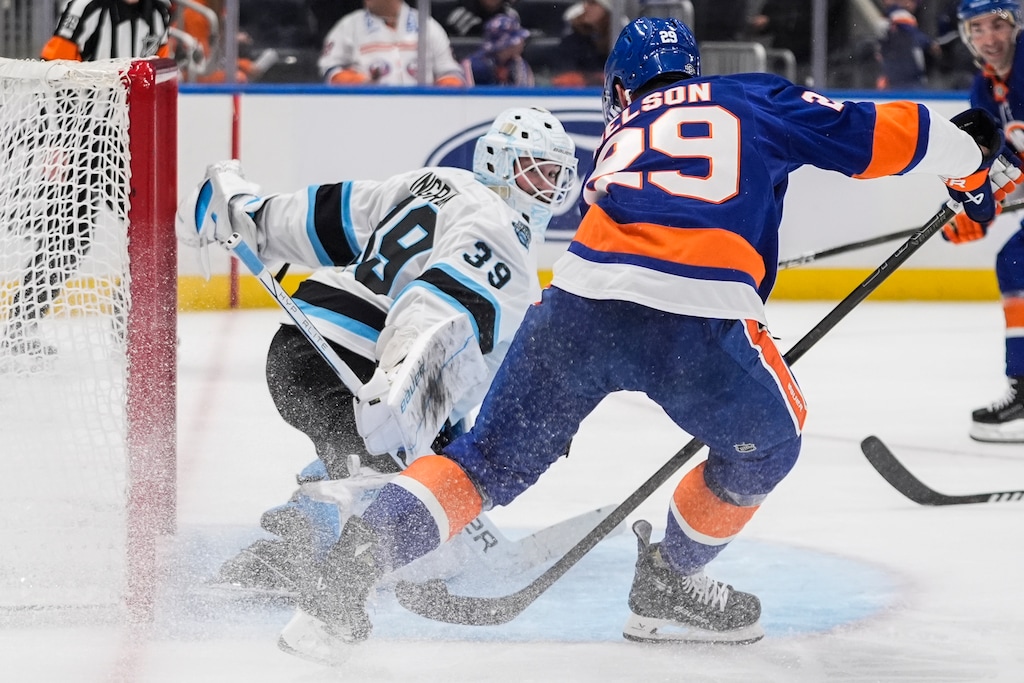 Utah Hockey Club goaltender Connor Ingram (39) stops a shot by New York Islanders' Brock Nelson (29) during the second period of an NHL hockey game, Thursday, Oct. 10, 2024, in Elmont, N.Y. (AP Photo/Frank Franklin II)