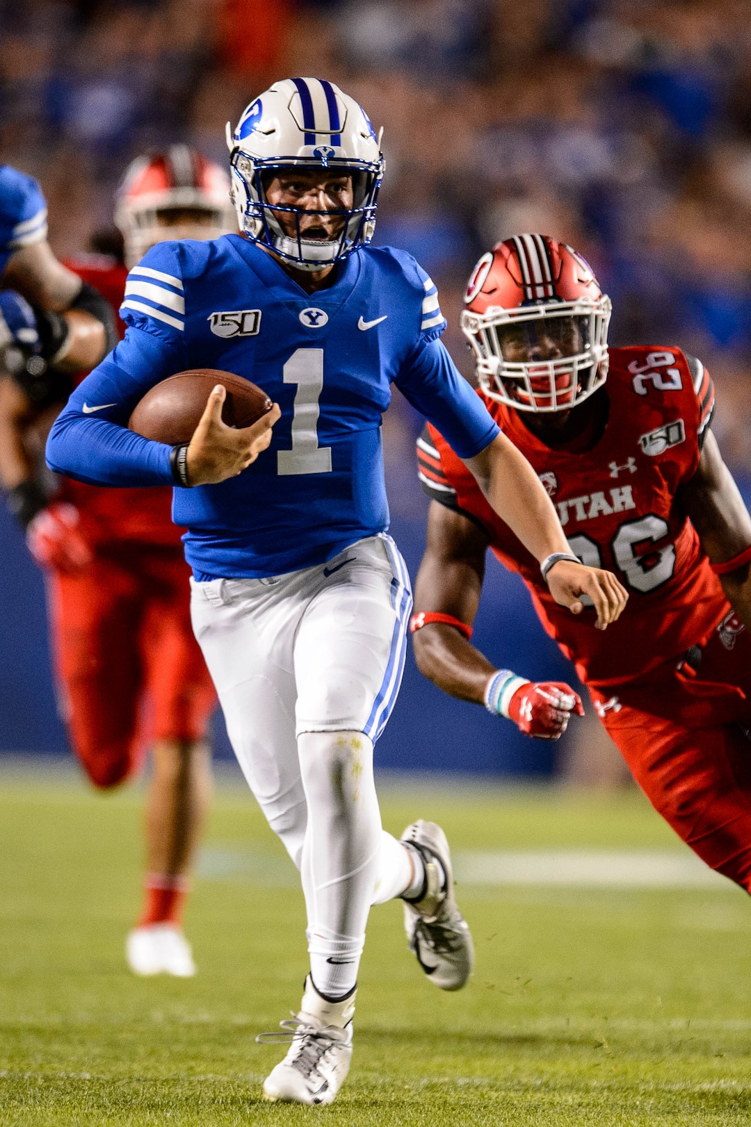 (Trent Nelson  |  The Salt Lake Tribune)  Brigham Young Cougars quarterback Zach Wilson (1) runs the ball as Brigham Young University (BYU) hosts the University of Utah, NCAA football in Provo on Thursday Aug. 29, 2019.