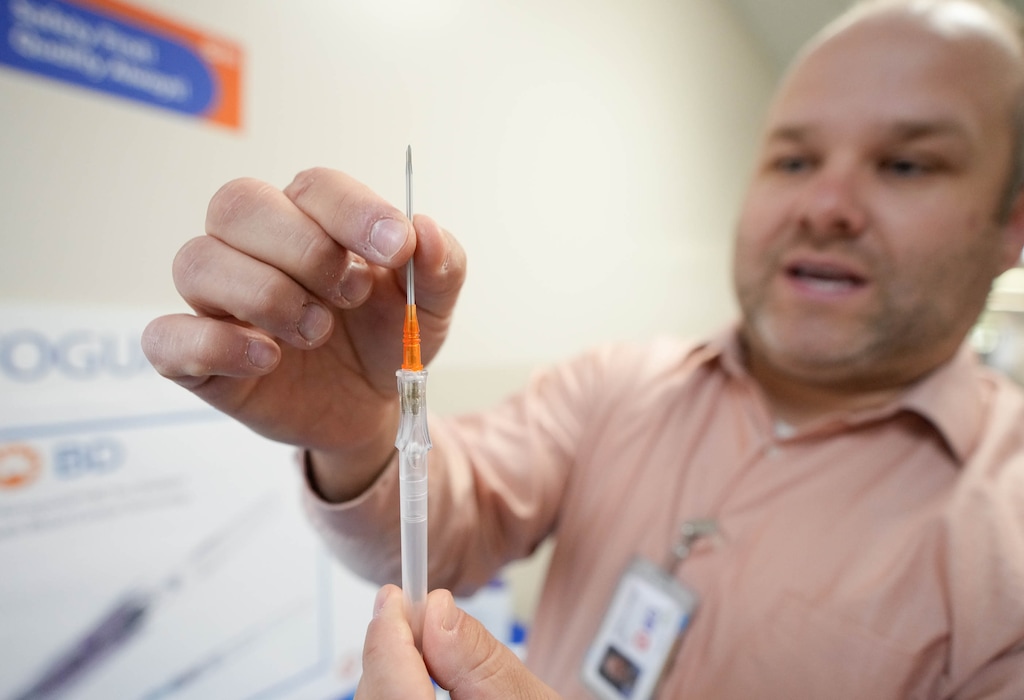 (Francisco Kjolseth | The Salt Lake Tribune) Josh Carson, senior materials manager at BD Medical Systems in Sandy, discusses the BD Insyte Autoguard pro shielded IV catheter with blood control technology that is meant to be more comfortable when inserted in the arm during a tour of the manufacturing process on Tuesday, Oct. 18, 2022.