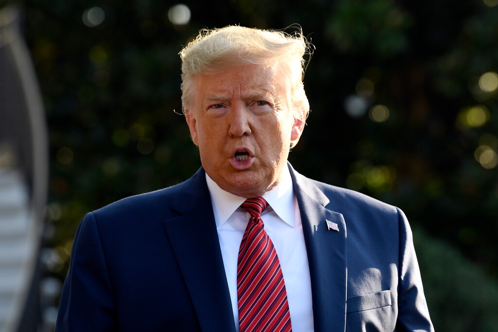 (Susan Walsh | AP)  President Donald Trump talks with reporters before leaving on Marine One on the South Lawn of the White House in Washington, Sunday, Sept. 22, 2019.