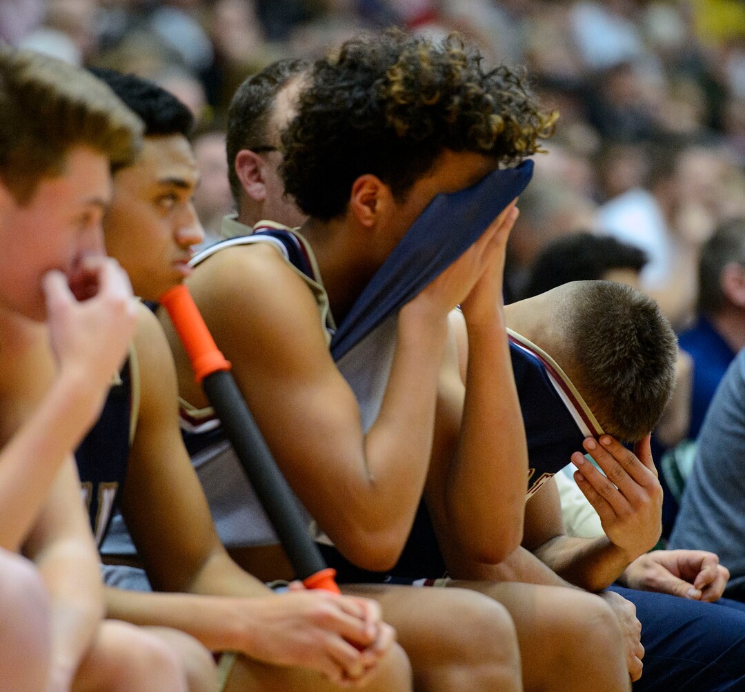 (Steve Griffin  |  The Salt Lake Tribune) Herriman put their heads inside their jerseys as Lone Peak builds a big lead in the second half off their 6A basketball playoff game at the Utah Valley UniversityÕs UCCU Center in Provo Tuesday Feb. 27, 2018.