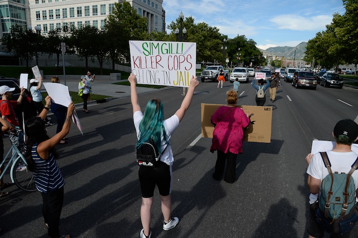 (Francisco Kjolseth  |  The Salt Lake Tribune) Sofia Alcala leads the crowd as they chant during a Rally for Bernardo Palacios, in front of the Salt Lake County District Attorney's office and block traffic along 500 S. on Thursday, June 18, 2020.