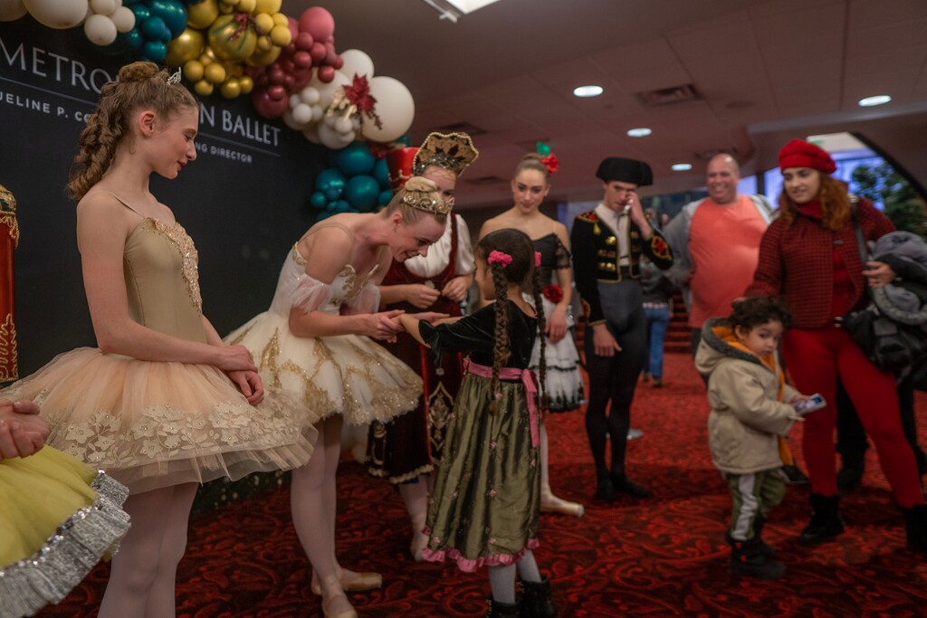 (Utah Metropolitan Ballet) A dancer with Utah Metropolitan Ballet greets a young fan, after a performance for families affected by autism. The free performances were funded in part from a grant from the National Endowment for the Arts — a grant that the federal agency withdrew on May 2, 2025.