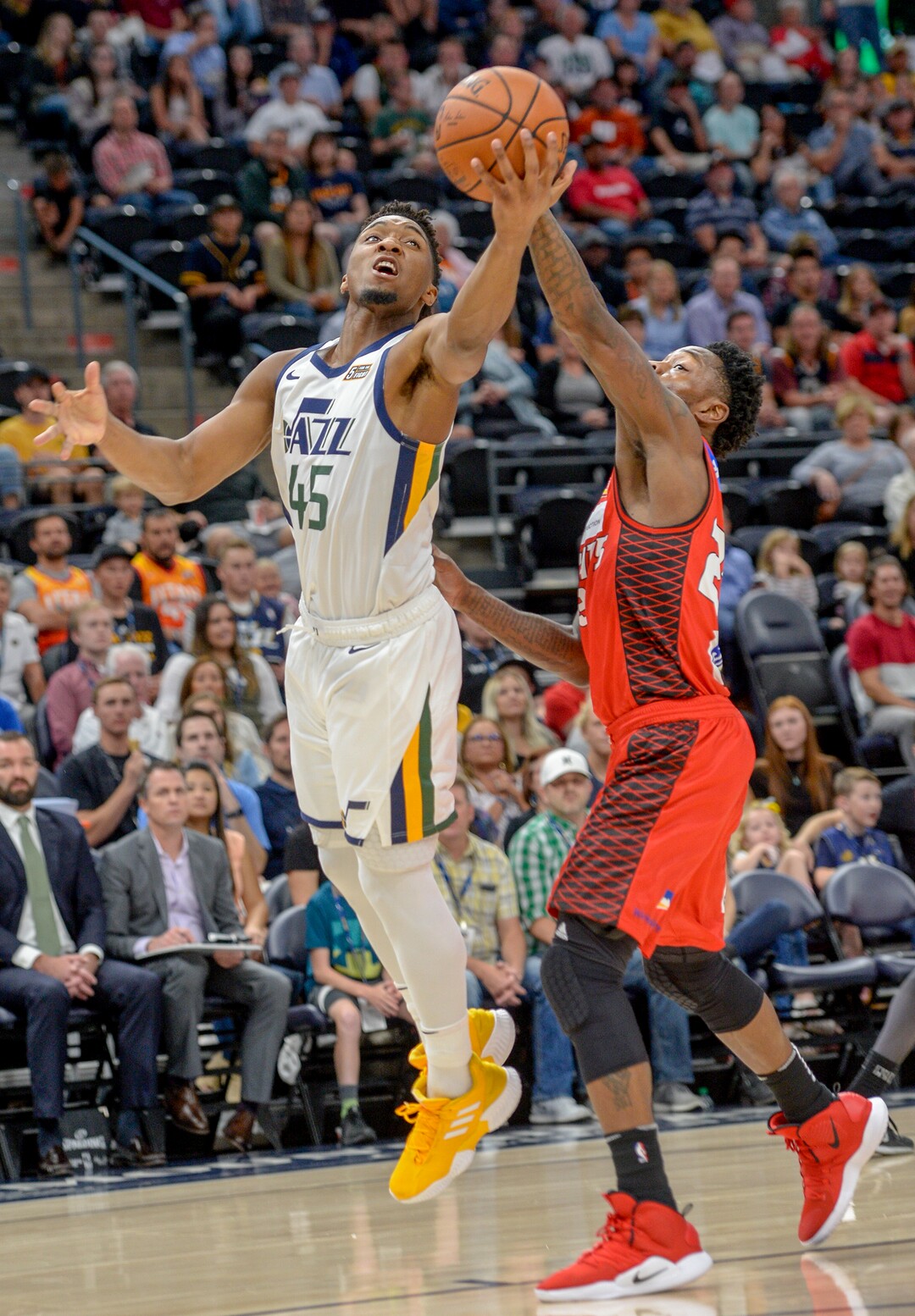 Leah Hogsten  |  The Salt Lake Tribune   Utah Jazz guard Donovan Mitchell (45) get the ball knocked away by Perth Wildcats guard Terrico White (23) in the first half as the Utah Jazz host the Perth Wildcats during their preseason game, Sept. 29, 2018 at Vivint Smart Home Arena.