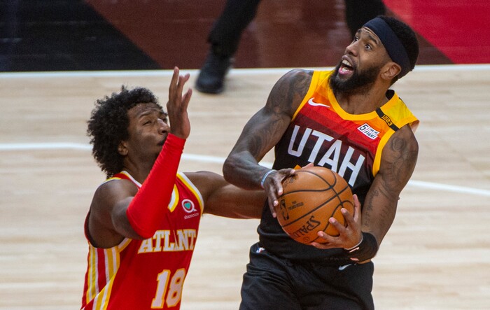 (Rick Egan | The Salt Lake Tribune) Utah Jazz forward Royce O'Neale (23) goes in for a shot, as Atlanta Hawks forward Solomon Hill (18) defends, in NBA action between the Utah Jazz and the Atlanta Hawks at Vivint Arena, on Friday, Jan. 15, 2021.