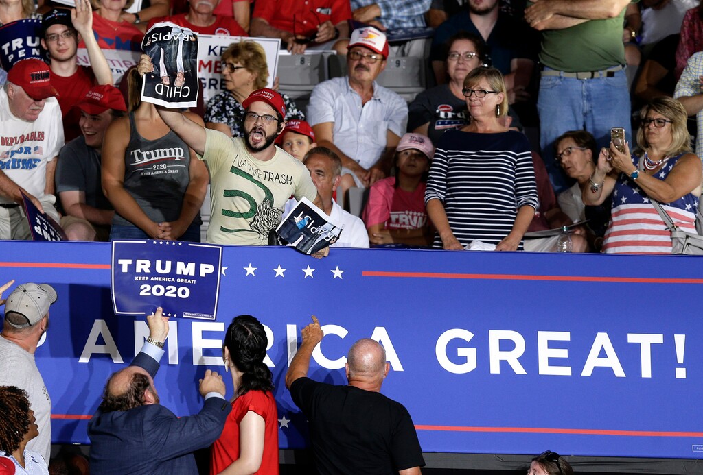 (Gerry Broome | AP file photo) A protester yells while President Donald Trump speaks a a campaign rally in Greenville, N.C., Wednesday, July 17, 2019.