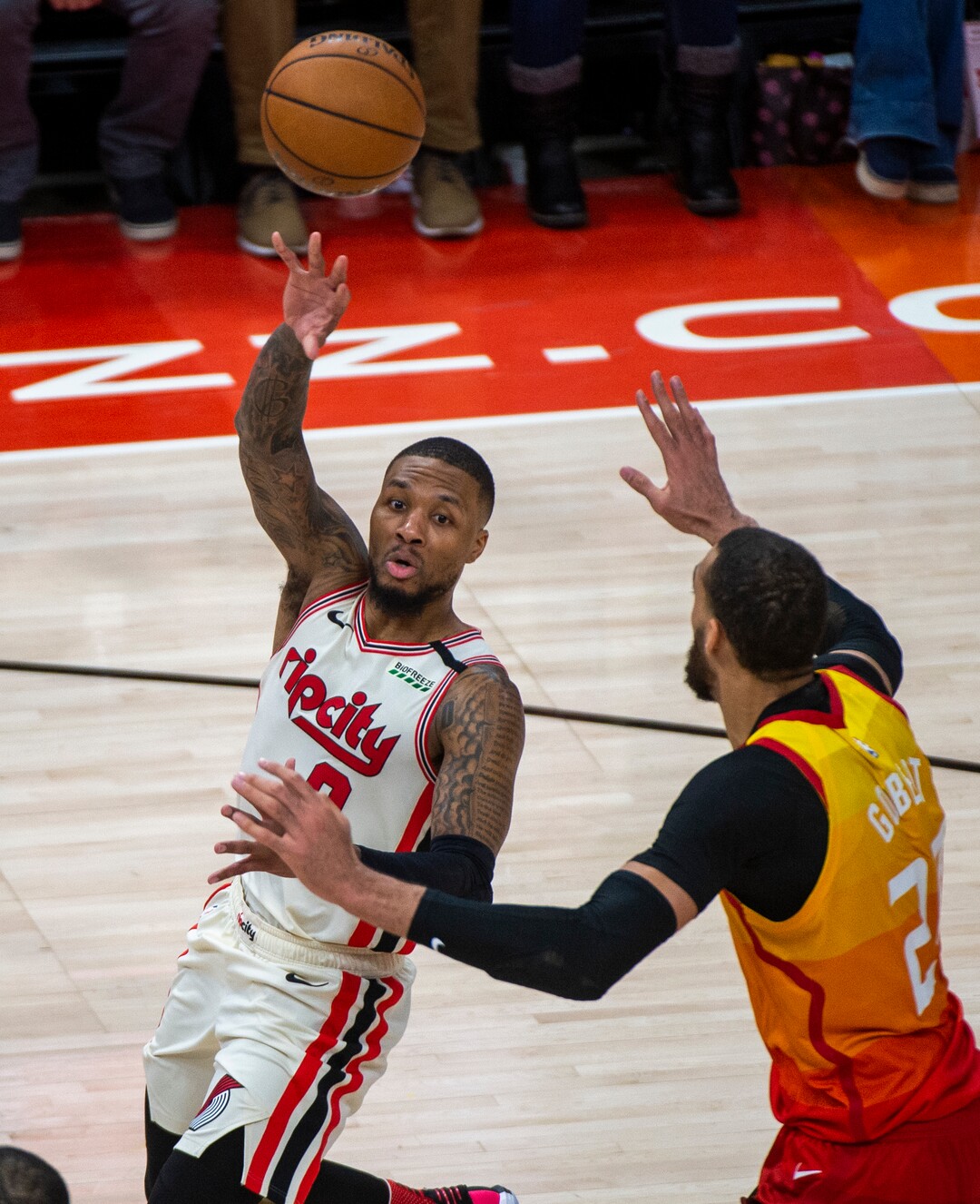 (Rick Egan  |  The Salt Lake Tribune)     Trail Blazers guard Damian Lillard (0) lobs a pass over Utah Jazz center Rudy Gobert (27), in the Jazz 117-114 win over the Portland Trail Blazers, in NBA action in Salt Lake City, Friday, Feb. 7, 2020.