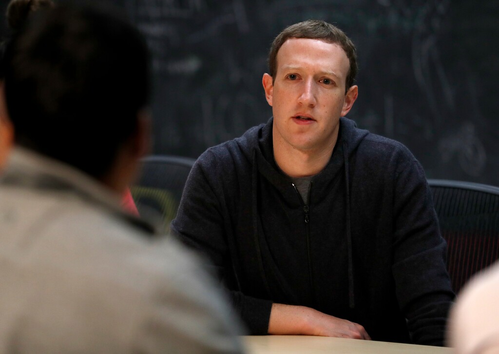 (Jeff Roberson | Associated Press file photo) This Nov. 9, 2017, file photo shows Facebook CEO Mark Zuckerberg meeting with a group of entrepreneurs and innovators during a round-table discussion at Cortex Innovation Community technology hub  in St. Louis. Facebook is announcing its second major tweak to its algorithm this month, saying it will prioritize news based on users’ votes. The company said in a blog post and Facebook post from Zuckerberg Friday, jan. 19, 2018,  that it will survey users about how familiar they are with a news source and if they trust it.