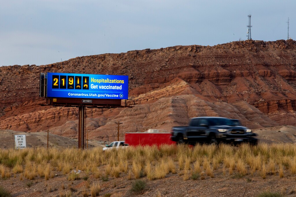 (Jud Burkett | Special to The Tribune) Drivers pass a digital billboard encouraging vaccinations on Interstate 15 near Exit 4 in St. George, Wednesday, Oct. 6, 2021. The billboard alternates between vaccination messages in English and in Spanish.