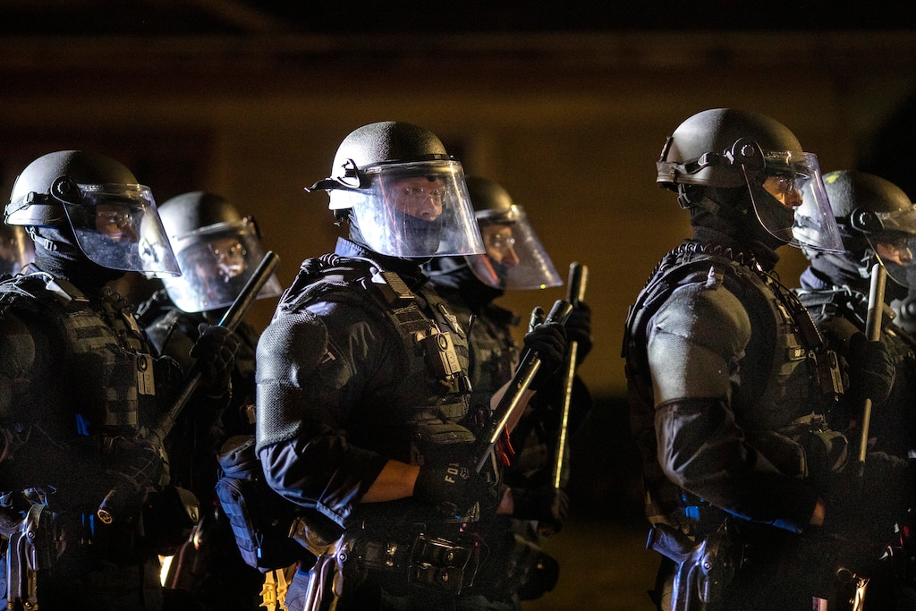 (AP Photo/Paula Bronstein)

Portland police take control of the streets after making arrests on the scene of the nightly protests at a Portland police precinct on Sunday, Aug. 30, 2020 in Portland, Ore. Oregon State Police will return to Portland to help local authorities after the fatal shooting of a man following clashes between President Donald Trump supporters and counter-protesters that led to an argument between the president and the city's mayor over who was to blame for the violence.