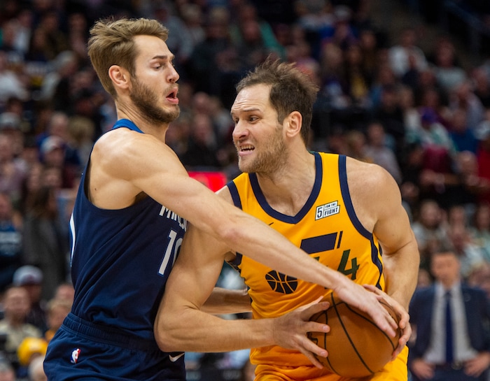 (Rick Egan  |  The Salt Lake Tribune)     Utah Jazz forward Bojan Bogdanovic (44) takes the ball to the hoop as Minnesota Timberwolves forward Jake Layman (10) defends, in NBA action between the Utah Jazz and the Minnesota Timberwolves in Salt Lake City, Monday, Nov. 18, 2019.