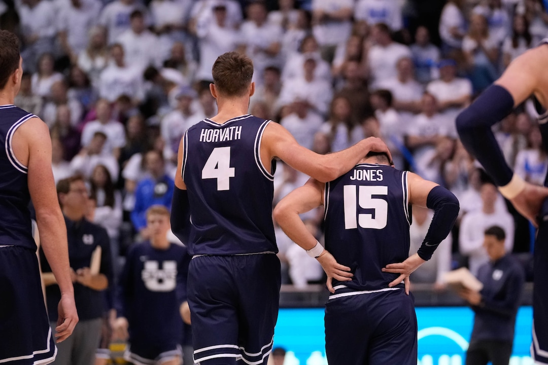 (Francisco Kjolseth | The Salt Lake Tribune) IUtah State Aggies forward Brandon Horvath (4) comforts Utah State Aggies guard Rylan Jones (15) following a missed opportunity in basketball action between the Brigham Young Cougars and the Utah State Aggies at the Marriott Center in Provo, Wednesday, Dec. 8, 2021.