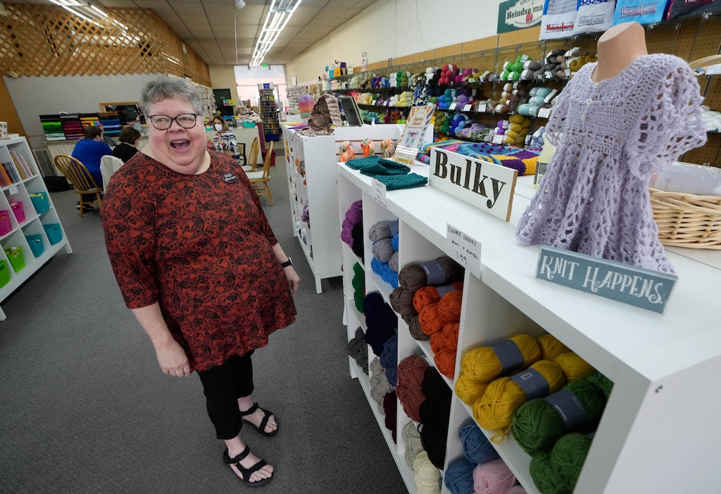 (Francisco Kjolseth  | The Salt Lake Tribune) Mary Lynn Warner, the newest owner of Heindselman's Yarn and Needlework shop in Provo, welcomes a customer.
