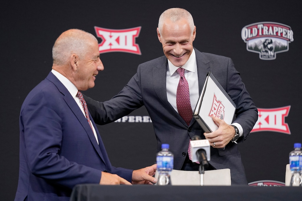 (LM Otero | AP) Incoming Big 12 Commissioner Brett Yormark, right, shares a laugh with outgoing Commissioner Bob Bowlsby at a news conference opening the NCAA college football Big 12 media days in Arlington, Texas, Wednesday, July 13, 2022.
