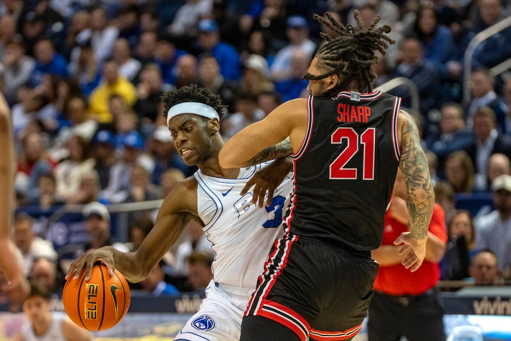 (Rick Egan | The Salt Lake Tribune) BYU Cougars forward AJ Dybantsa (3) collides with Houston Cougars guard Emanuel Sharp (21) at the Marriott Center earlier this season. The Cougars will play the winner of Texas and North Carolina State in the NCAA Tournament.
