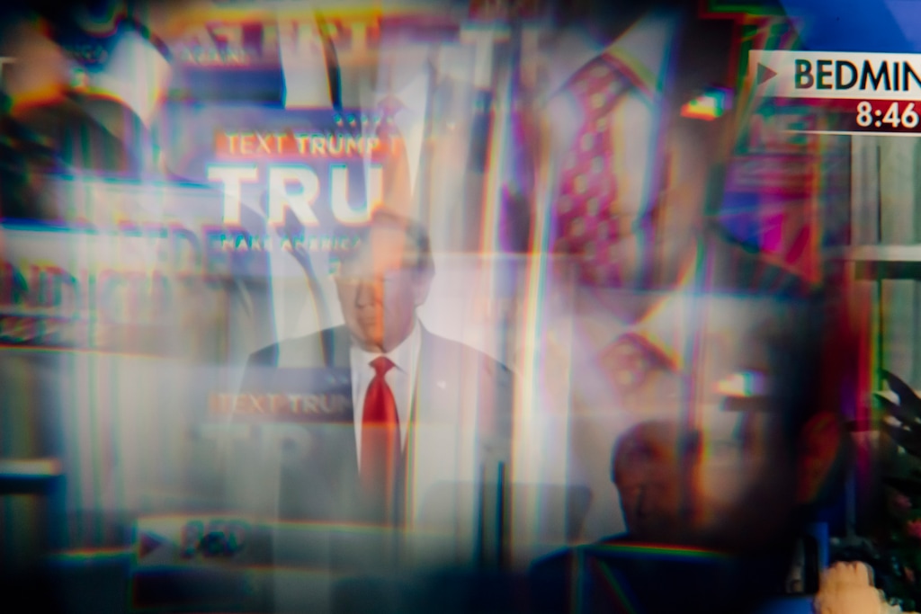 FILE — A distorted image of former President Donald Trump on a television screen during a news program, June 13, 2023. “Before we can fight authoritarianism, we have to fight fatalism,” writes The New York Times columnist Michelle Goldberg. “My great hope for 2024 is that anti-Trump Americans can transcend exhaustion, burnout and self-protective pessimism to mobilize once again for the latest most important election of our lifetimes.” (Damon Winter/ The New York Times)