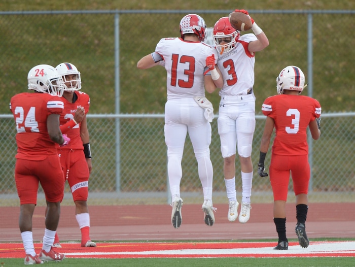 (Leah Hogsten  |  The Salt Lake Tribune) American Fork's Jeff Harris celebrates his touchdown with teammate Mitchell Johnson. American Fork High School boys' football team East High School during their class 6A state quarterfinal football game, Friday, November 3, 2017
