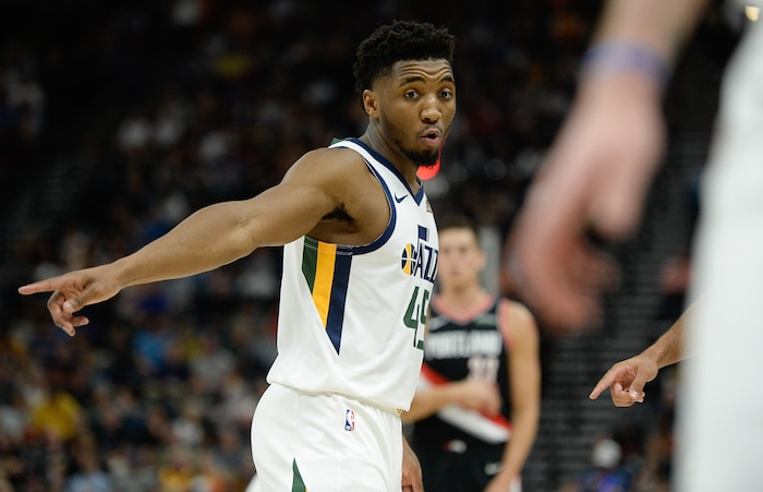 (Francisco Kjolseth  |  The Salt Lake Tribune)  Utah Jazz guard Donovan Mitchell (45) gestures to teammates as the Utah Jazz host the Portland Trailblazers in their NBA basketball game at Vivint Smart Home Arena in Salt Lake City on Wed. Oct. 16, 2019.