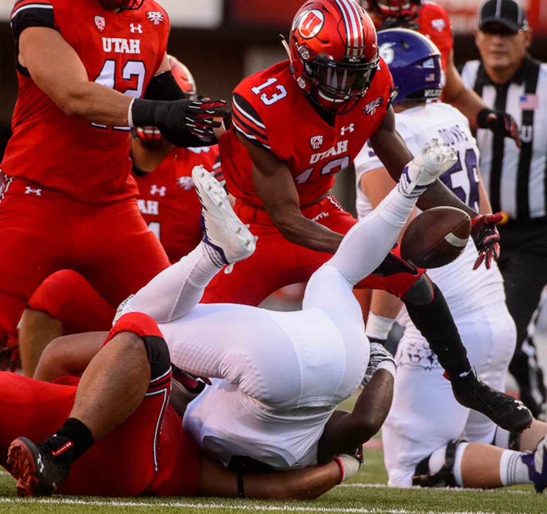 (Trent Nelson | The Salt Lake Tribune)  Utah Utes defensive back Marquise Blair (13) grabs a ball stripped from Weber State Wildcats running back Treshawn Garrett (6) as the University of Utah Utes host the Weber State Wildcats, Thursday Aug. 30, 2018 at Rice-Eccles Stadium in Salt Lake City. The ball was ruled dead before the turnover.