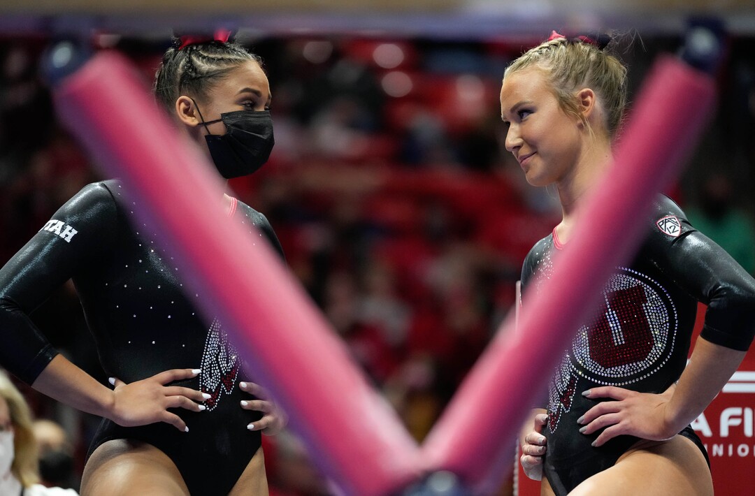 (Francisco Kjolseth | The Salt Lake Tribune) Utah’s Jaedyn Rucker, left, encourages Abby Paulson before her time on the beam during their gymnastics meet with Stanford at the Huntsman Center in Salt Lake City, Saturday, Jan. 29, 2022.