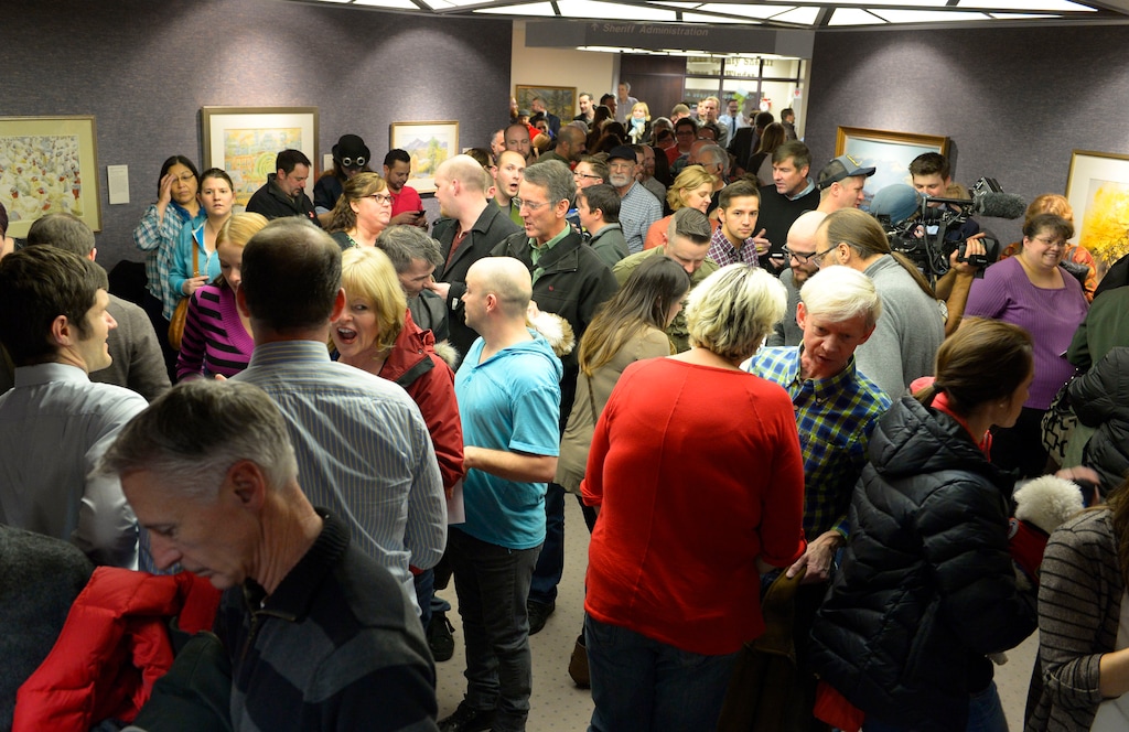 (Keith Johnson | The Salt Lake Tribune) Hundreds of people gather outside the Salt Lake County clerk's office, Friday, Dec. 20, 2013 waiting to apply for marriage licenses after a federal judge in Utah Friday struck down the state's ban on same-sex marriage, saying the law violates the U.S. Constitution's guarantees of equal protection and due process.