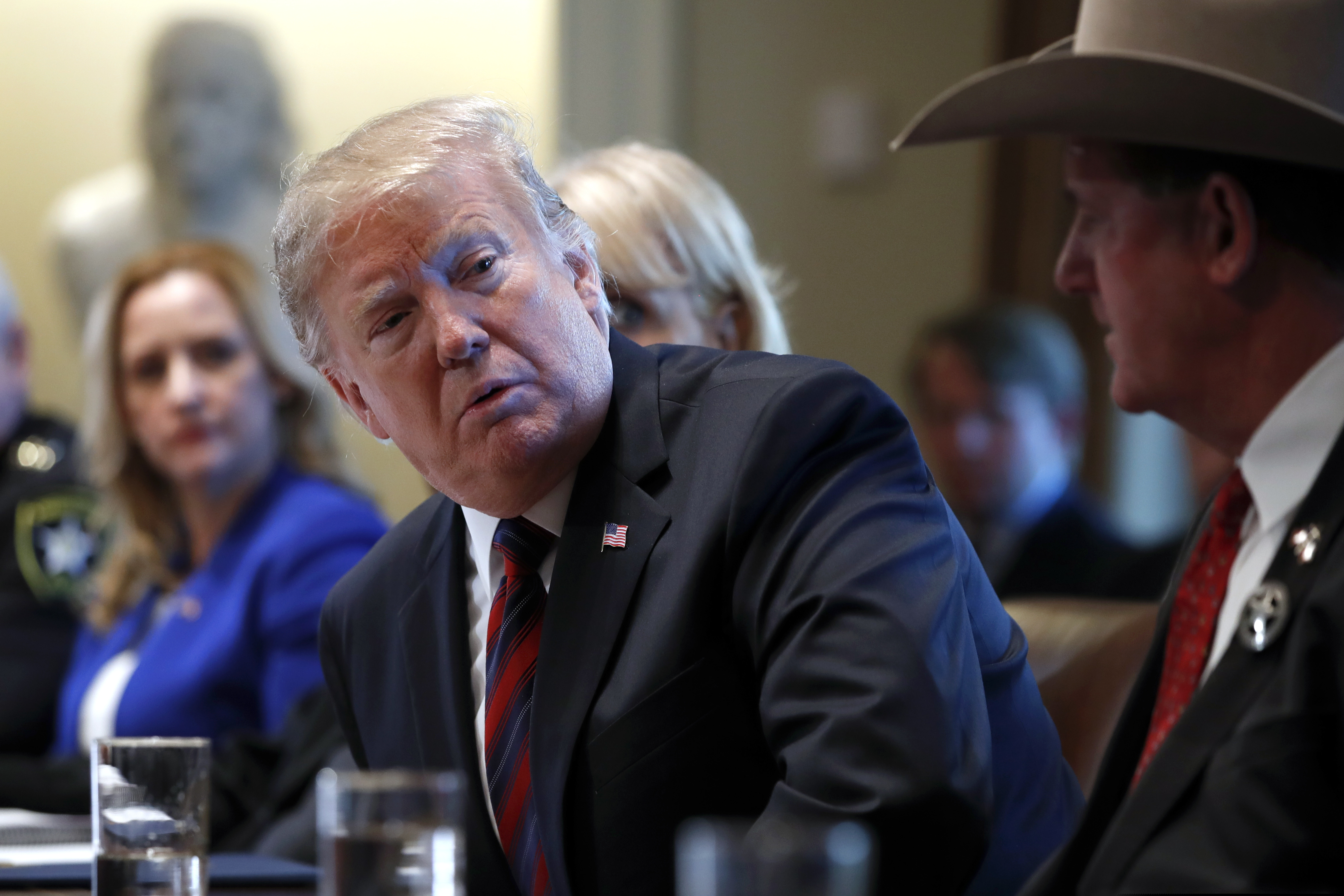 (AP Photo/Jacquelyn Martin) President Donald Trump listens as he leads a roundtable discussion on border security with local leaders, Friday, Jan. 11, 2019, in the Cabinet Room of the White House in Washington.