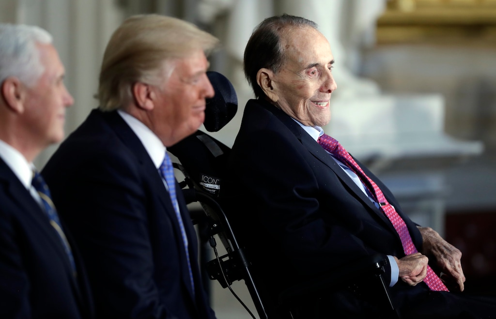 President Donald Trump, center and Vice President Mike Pence watch during a Congressional Gold Medal ceremony honoring former Senator Bob Dole on Capitol Hill, Wednesday, Jan. 17, 2018, in Washington. (AP Photo/Evan Vucci)
