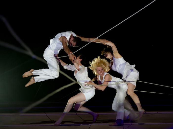 Photo courtesy of Jim Stone) Oakland, Calif.-based “vertical dance” company BANDALOOP performs at the San Francisco Public Canvas event. BANDALOOP will be appearing at the Utah Arts Festival June 21-24, and will perform twice daily (5:30 and 7 p.m.) on the six-story library glass wall above the reflecting pool.